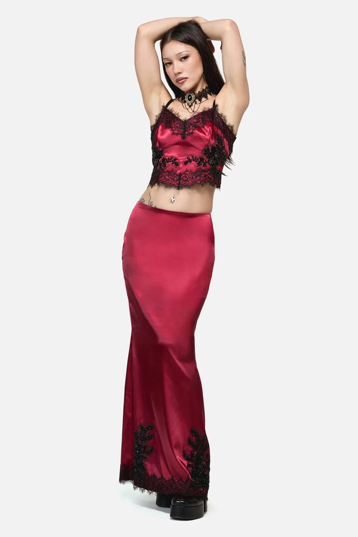 Image of a model wearing Skirts. Product name - Rosalie Formal Lace Trim Skirt in Red colour by brand - Dangerfield