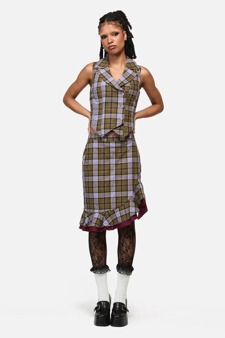 Image of a model wearing Skirts. Product name - Apothecarius Wrap Tartan Skirt in Moss/Lavender colour by brand - Black Friday