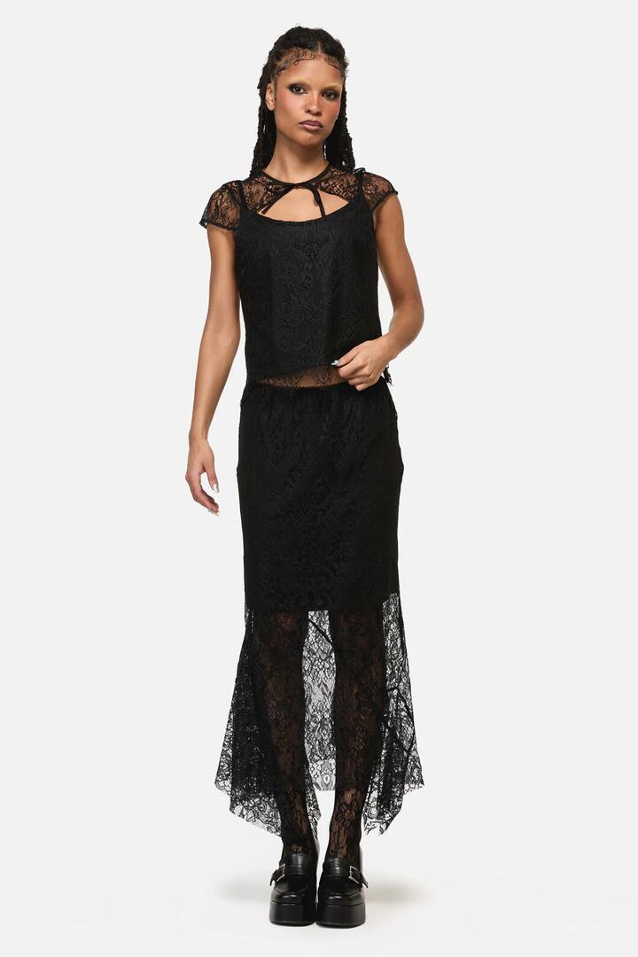Image of a model wearing Skirts. Product name - Ellen Lace Goth Formal Skirt in Black colour by brand - Black Friday