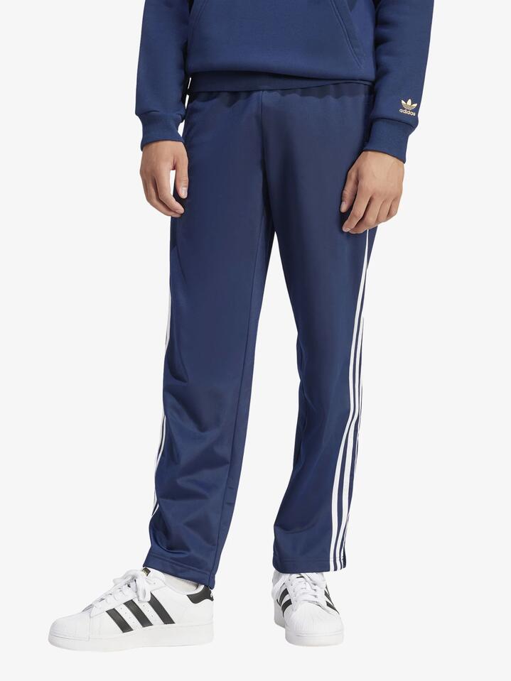 Image of a model wearing Pants. Productname: Adidas Men's Firebird Track Pant in Night Indigo colour by brand - Adidas