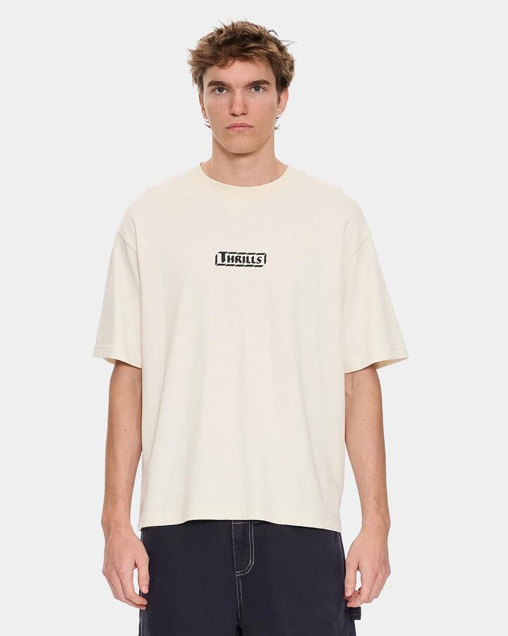 Image of a model wearing Tops. Productname: thrills Mens Calm State Oversized T-Shirt Unbleached - in Unbleached colour by brand - Thrills