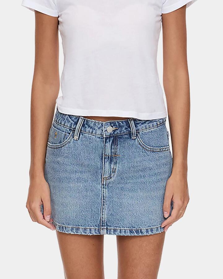 Image of a model wearing Skirts. Product name - Thrills Womens Sophie Denim Mini Skirt Rustic Fade in Rustic Fade colour by brand - Thrills
