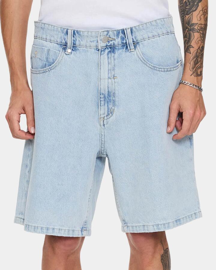 Image of a model wearing Shorts. Product name - Thrills Mens Slacker Denim Shorts Serenity Blue in Serenity Blue colour by brand - Thrills