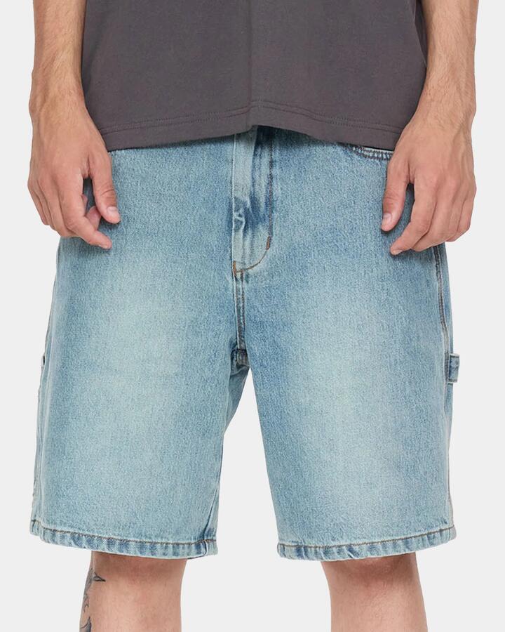 Image of a model wearing Shorts. Product name - Worship Mens Carpenter 2.0 Denim Shorts Light N Dirty in Light N Dirty colour by brand - Worship