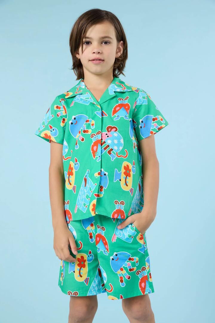 Image of a model wearing Shorts. Product name - Buggy Stripe Kids Shorts in Green colour by brand - Gorman