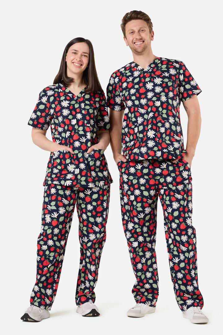 Image of a model wearing Uniforms & Workwear. Product name - La Fraise Scrub Set in Navy colour by brand - Scrubs With Love