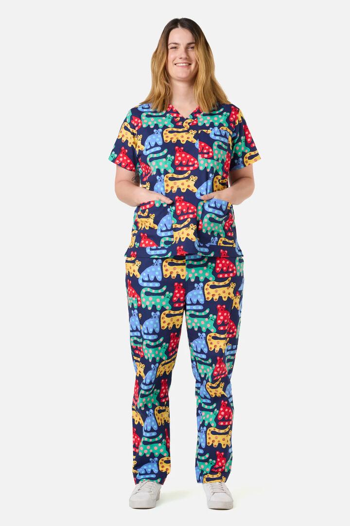Image of a model wearing Uniforms & Workwear. Product name - Cheetah Scrub Set in Navy colour by brand - Gorman