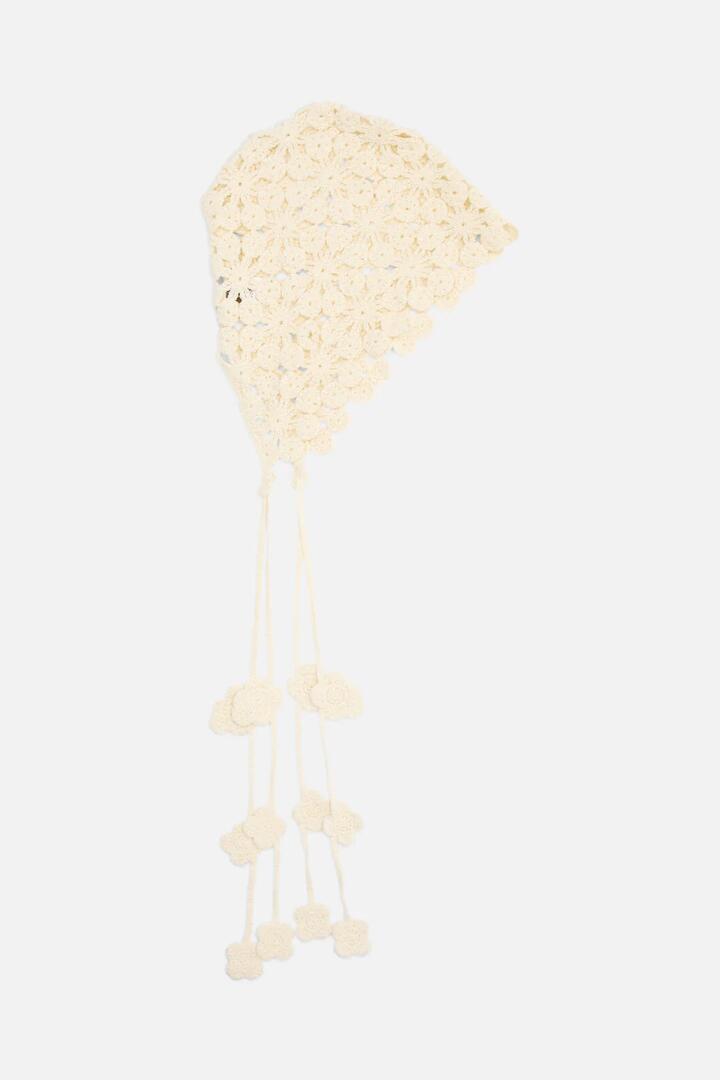 Image of a model wearing Tops. Productname: Knit Summer Bonnet in Cream colour by brand - Princess Highway