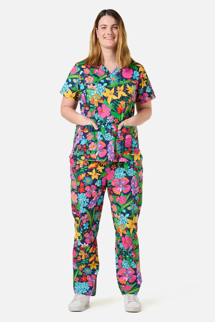 Image of a model wearing Uniforms & Workwear. Product name - Cottage Floral Scrub Set in Navy colour by brand - Gorman