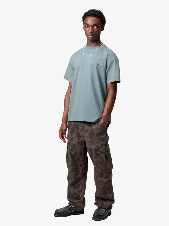 Image of a model wearing Shorts. Productname: Carhartt Wip Short Sleeve American Script T-Shirt in Citadel colour by brand - Carhartt Wip