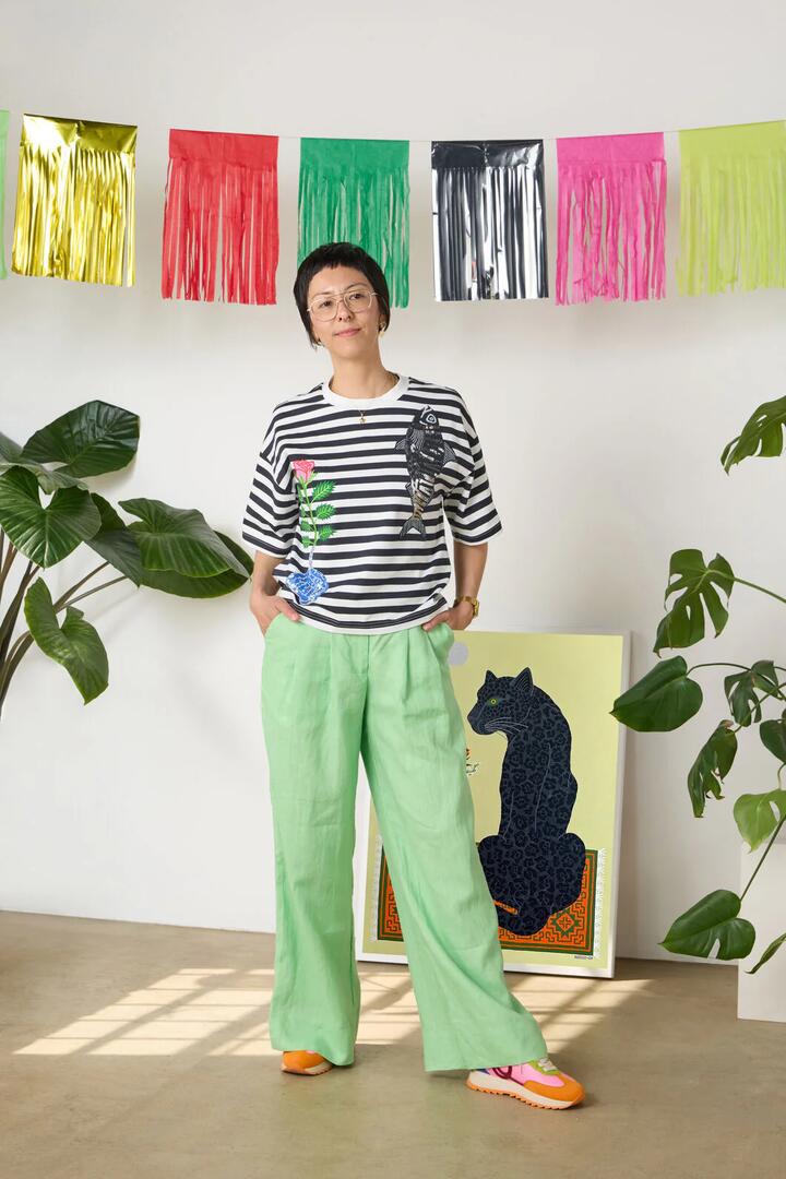 Image of a model wearing Pants. Product name - Olivia Tailored Linen Pant in Apple colour by brand - Gorman