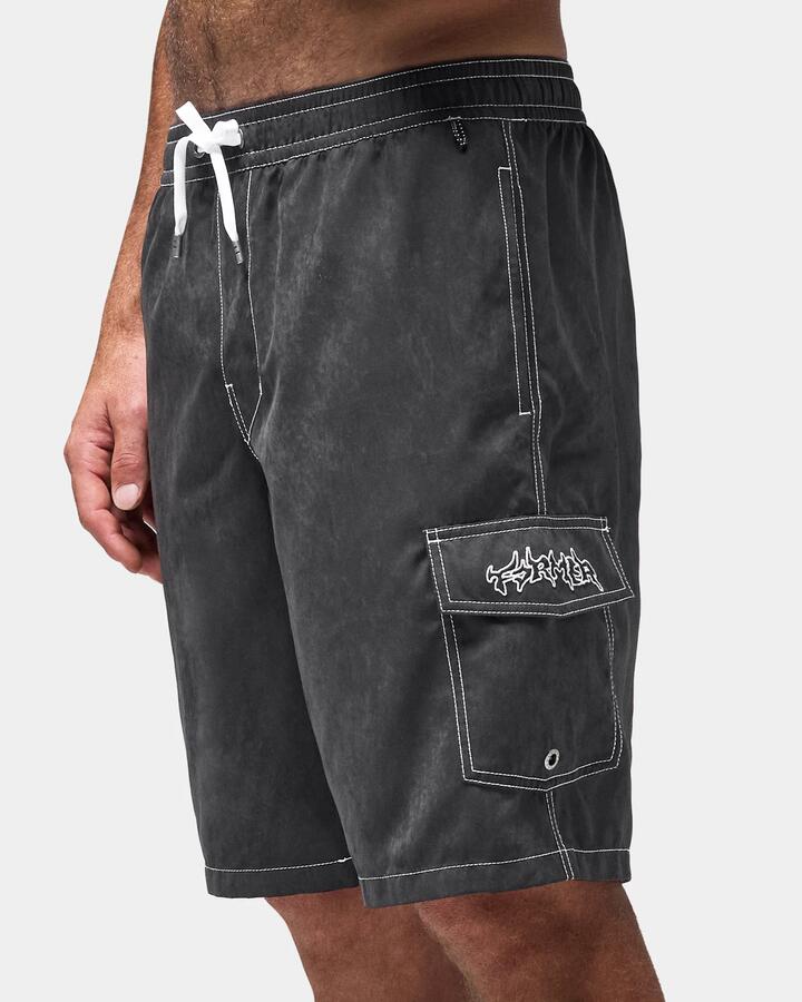Image of a model wearing Shorts. Product name - Former Mens Swans Cargo 21" Swim Shorts Black in Black colour by brand - Former