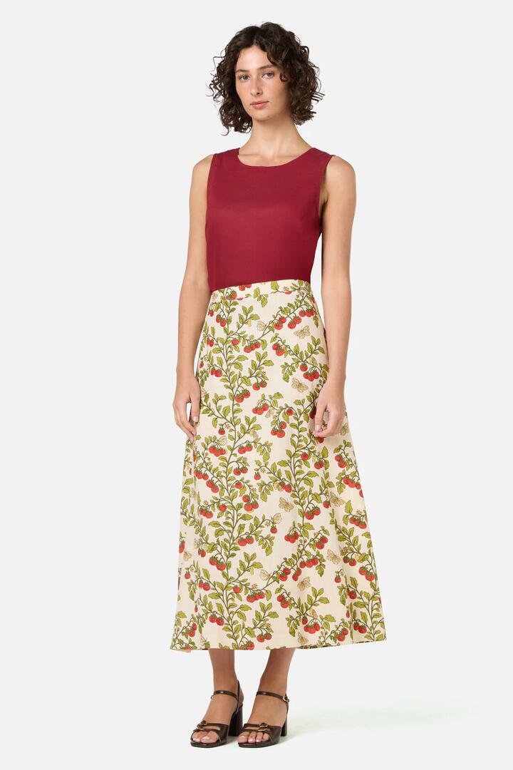 Image of a model wearing Skirts. Product name - Cherry Tomatoes Midi Skirt in Cream colour by brand - Princess Highway
