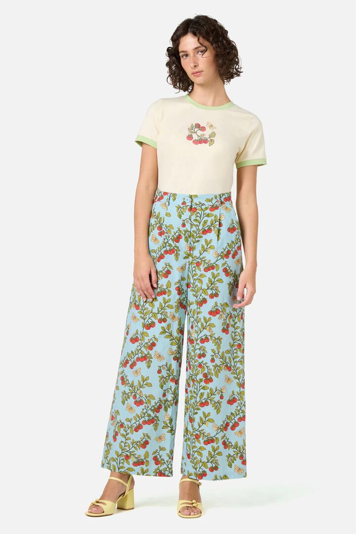 Image of a model wearing Pants. Product name - Cherry Tomatoes Relaxed Pant in Blue colour by brand - Princess Highway