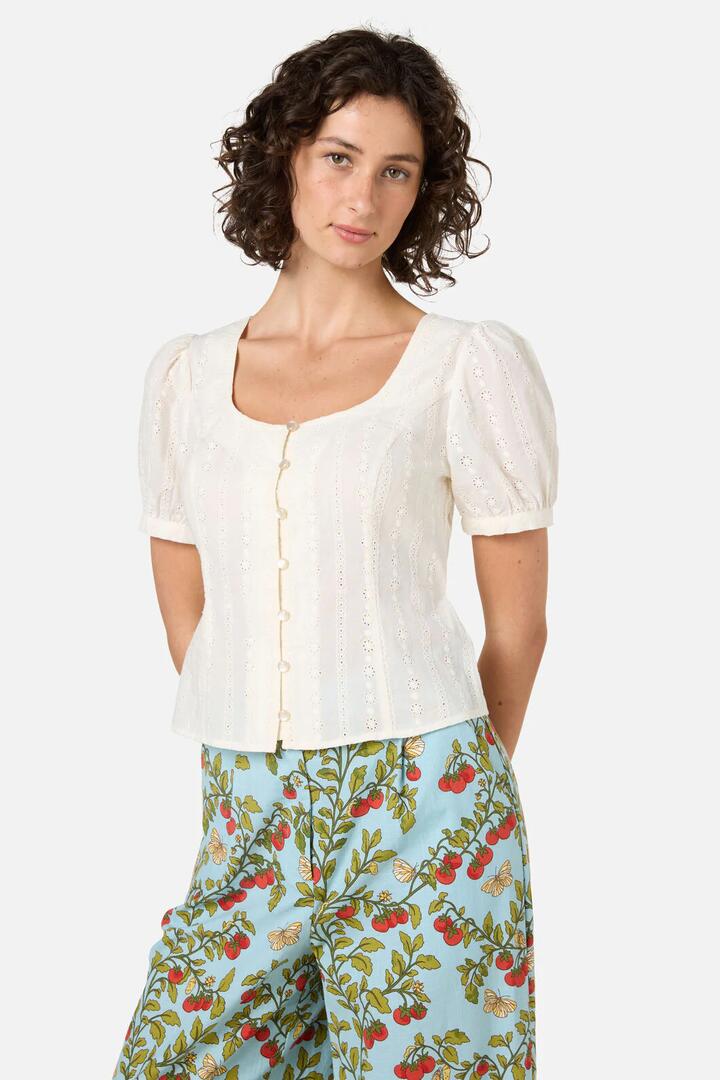 Image of a model wearing Tops. Product name - Nora Prairie Short Sleeve Top in Cream colour by brand - Princess Highway
