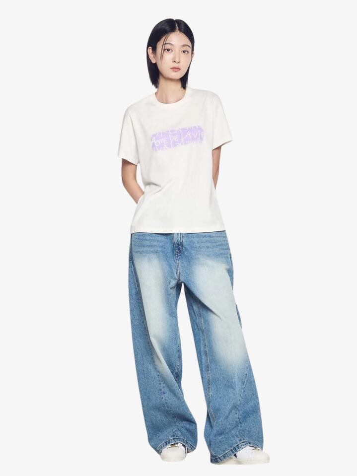 Image of a model wearing Tops. Productname: ADLV Woman's Ellipse Logo T-Shirt in Cream colour by brand - ADLV