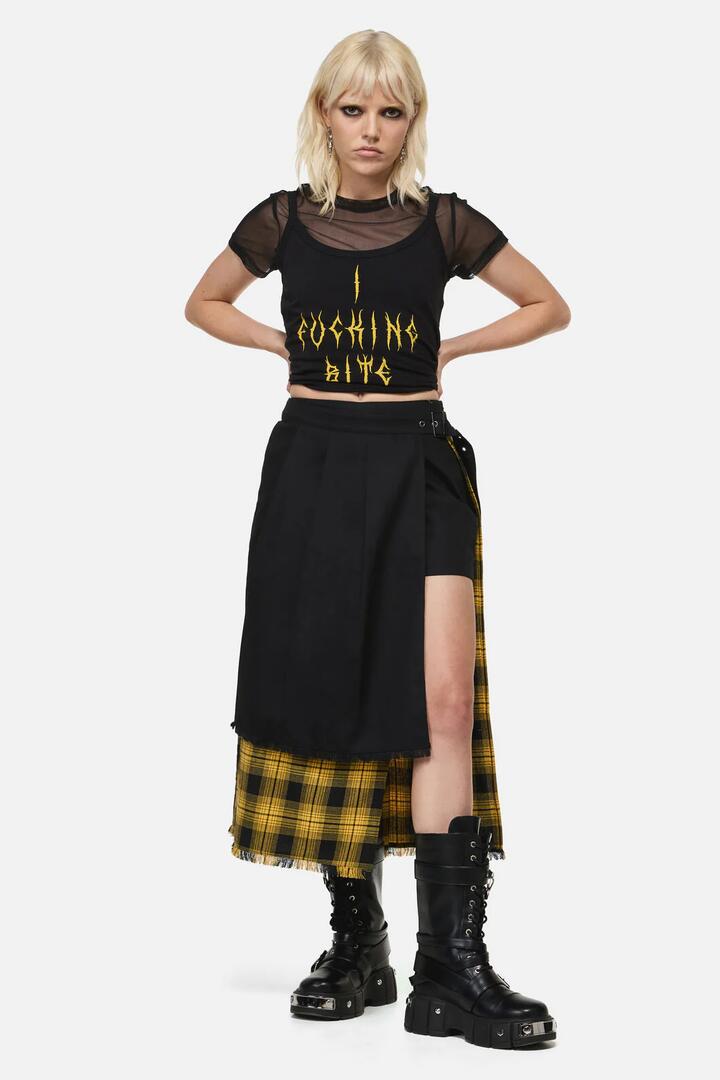 Image of a model wearing Skirts. Product name - Tai Tartan Punk Midi Skort in Yellow colour by brand - Dangerfield