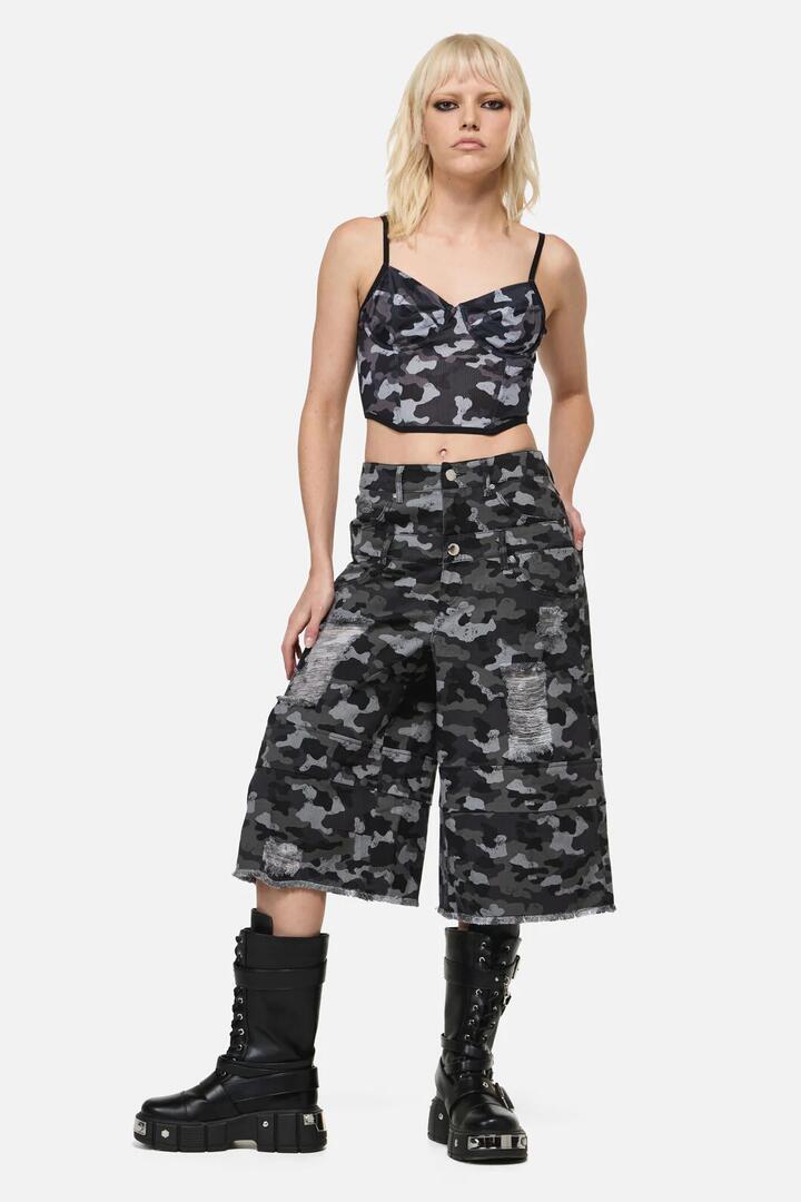Image of a model wearing Shorts. Product name - Disruptive Camp Distressed Jorts in Grey/Black colour by brand - Dangerfield