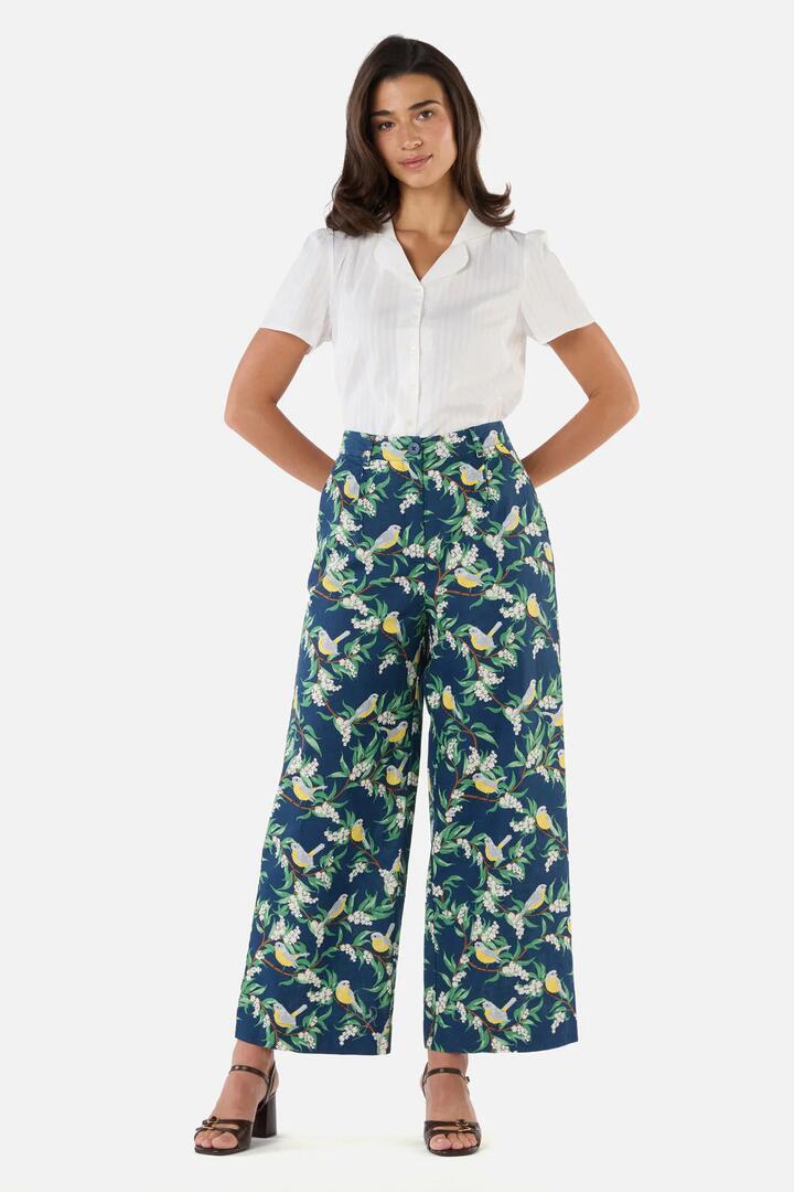 Image of a model wearing Pants. Product name - Yellow Robin Relaxed Pant in Navy colour by brand - Princess Highway
