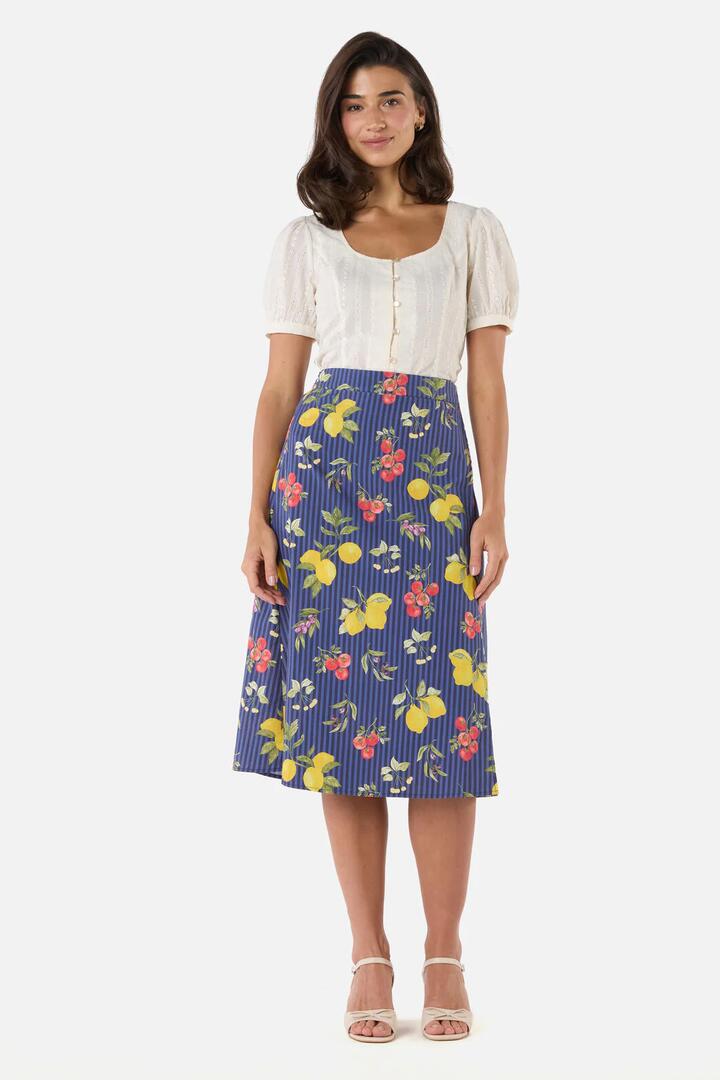 Image of a model wearing Skirts. Product name - Carla Picnic Midi Wrap Skirt in Navy colour by brand - Princess Highway