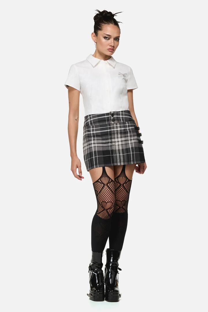 Image of a model wearing Skirts. Product name - Lovett Goth Tartan Skort in Grey colour by brand - Black Friday