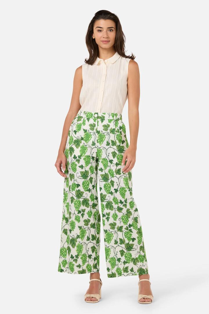 Image of a model wearing Pants. Product name - Grape Vine Summer Pant in Green colour by brand - Princess Highway