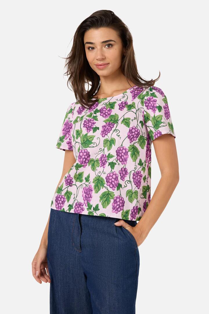Image of a model wearing Tops. Product name - Grape Vine Short Sleeve Top in Lilac colour by brand - Princess Highway