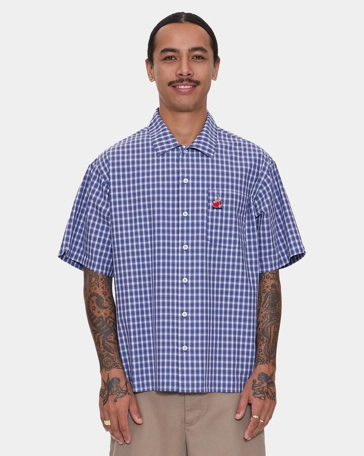 Image of a model wearing Tops. Product name - Worship Mens Glazed And Confused Short Sleeve Shirt Blue in Blue colour by brand - Worship