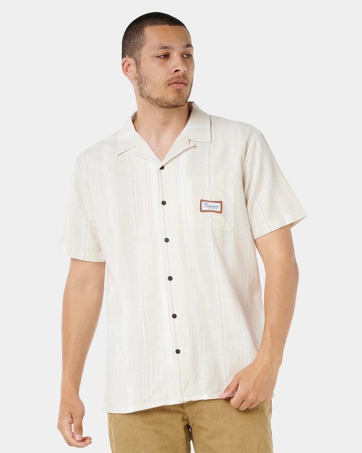 Image of a model wearing Tops. Productname: rip Curl - Mens Mod Cali Stripe Short Sleeve Shirt - Bone - in Bone colour by brand - rip Curl