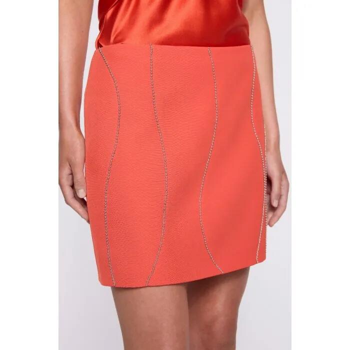 Image of a model wearing Skirts. Productname: Camille Mini Skirt in Tangerine colour by brand - sass and bide