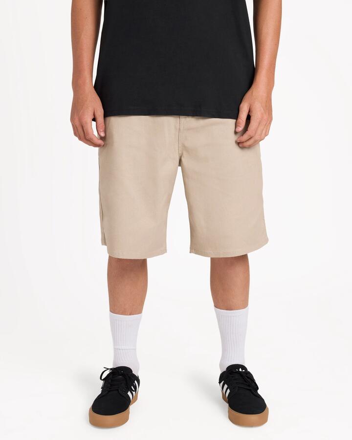Image of a model wearing Shorts. Product name - Volcom Mens Billow 22" Walkshorts Light Khaki in Light Khaki colour by brand - Volcom