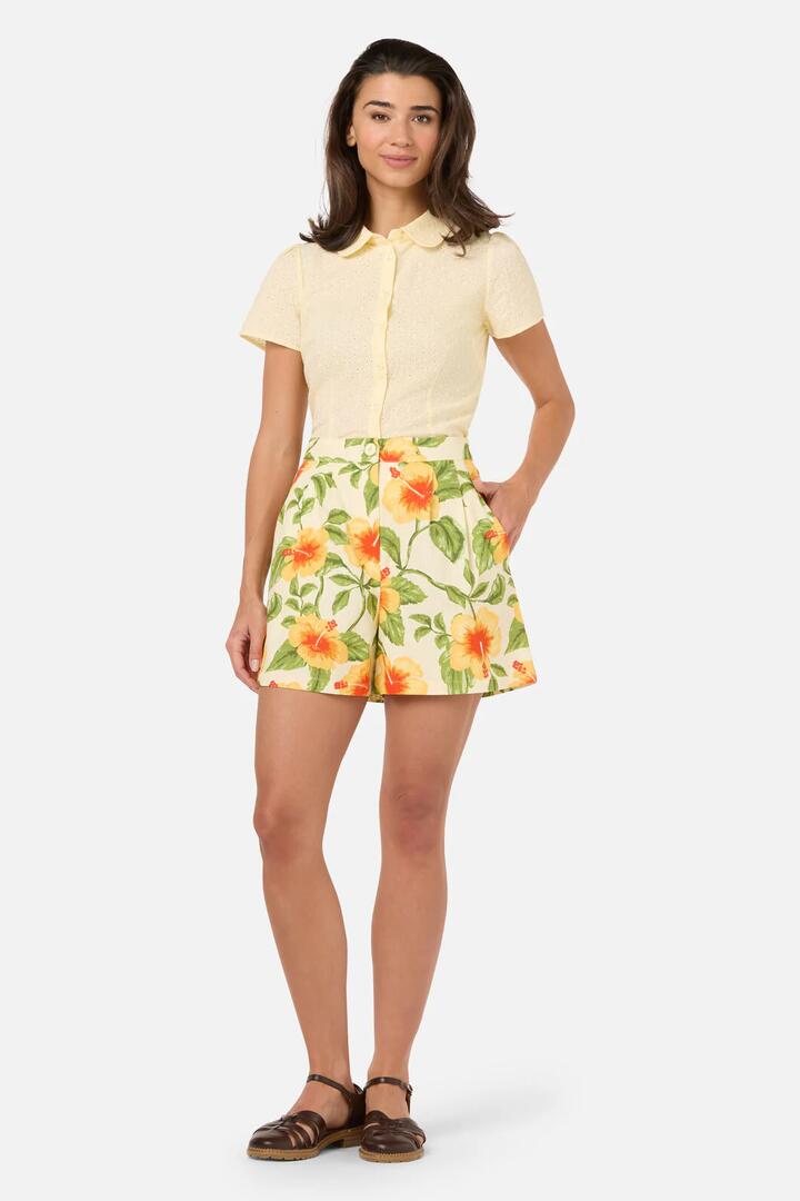 Image of a model wearing Shorts. Product name - Hibiscus Summer Short in Cream colour by brand - Princess Highway