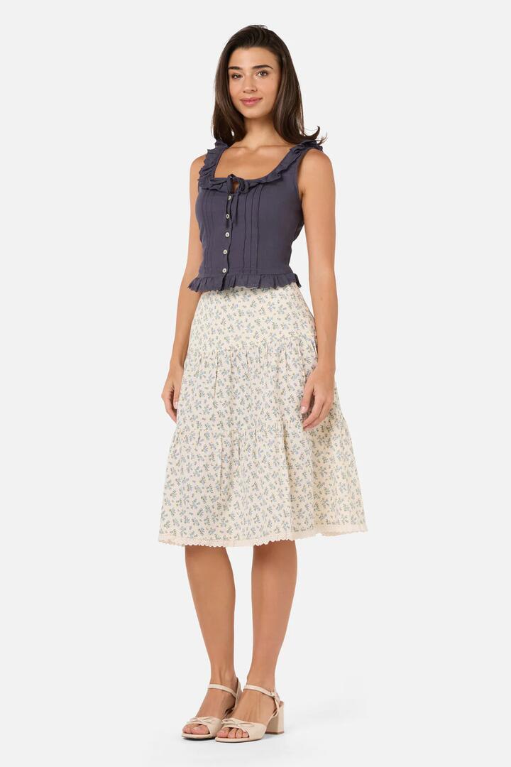 Image of a model wearing Skirts. Product name - Elodie Ditsy Tiered Skirt in Blue colour by brand - Princess Highway