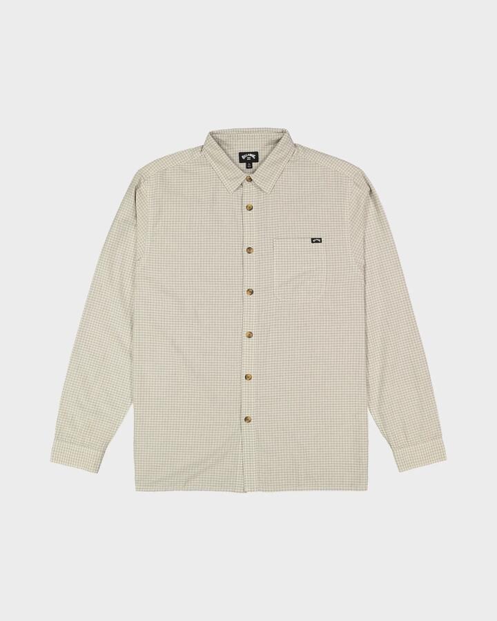 Image of a model wearing Tops. Product name - Billabong Mens Mogul Long Sleeve Shirt Oatmeal in Oatmeal colour by brand - Billabong