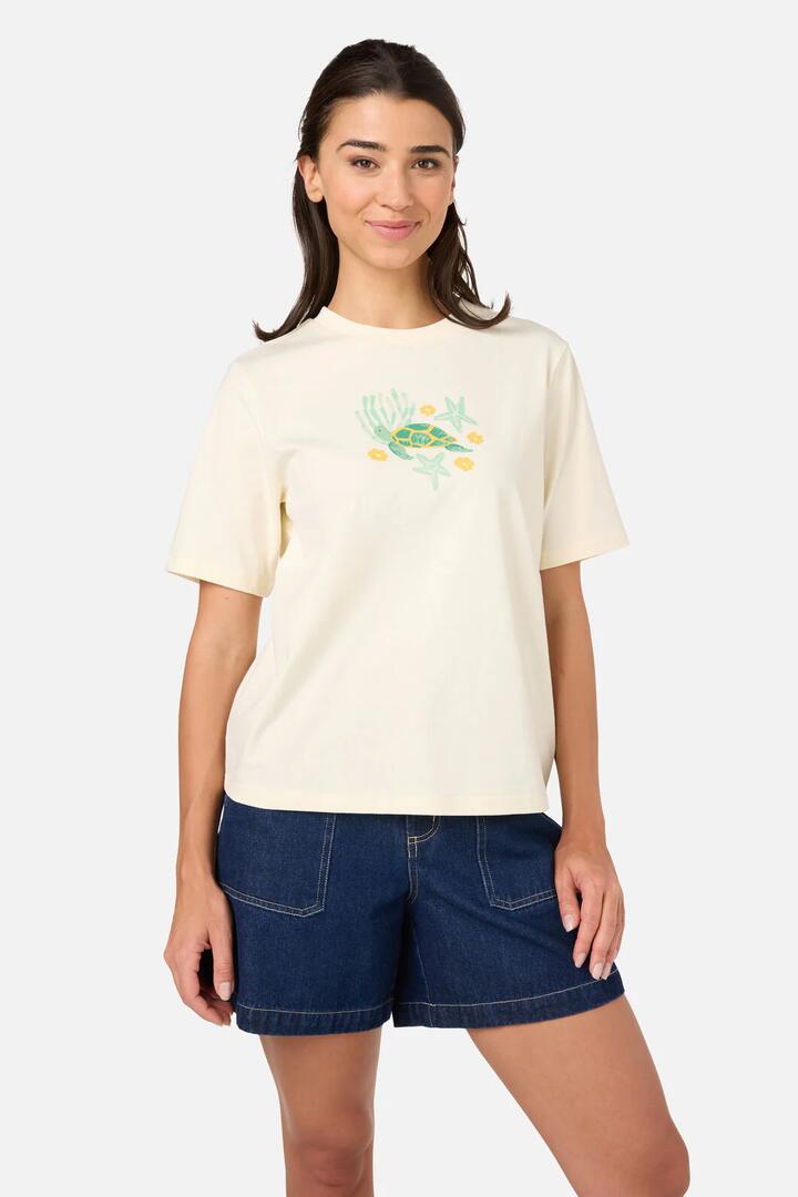 Image of a model wearing Tops. Product name - Cute Turtle Relaxed Tee in Cream colour by brand - Princess Highway