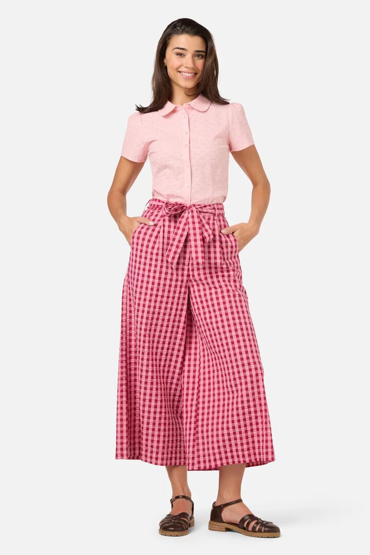 Image of a model wearing Pants. Product name - Margot Check Culotte in Pink colour by brand - Princess Highway