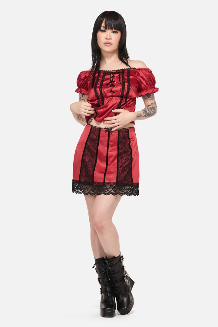 Image of a model wearing Skirts. Productname: Goodie Goth Lace Trim Skort in Red colour by brand - Black Friday