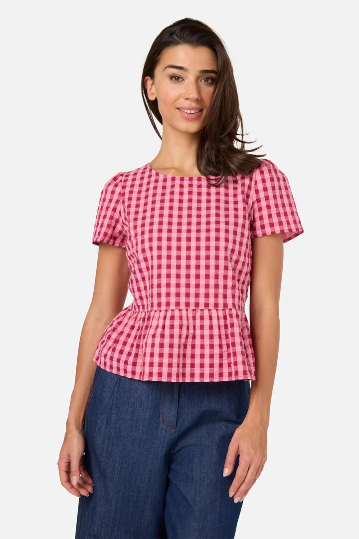 Image of a model wearing Tops. Product name - Margot Check Short Sleeve Top in Pink colour by brand - Princess Highway