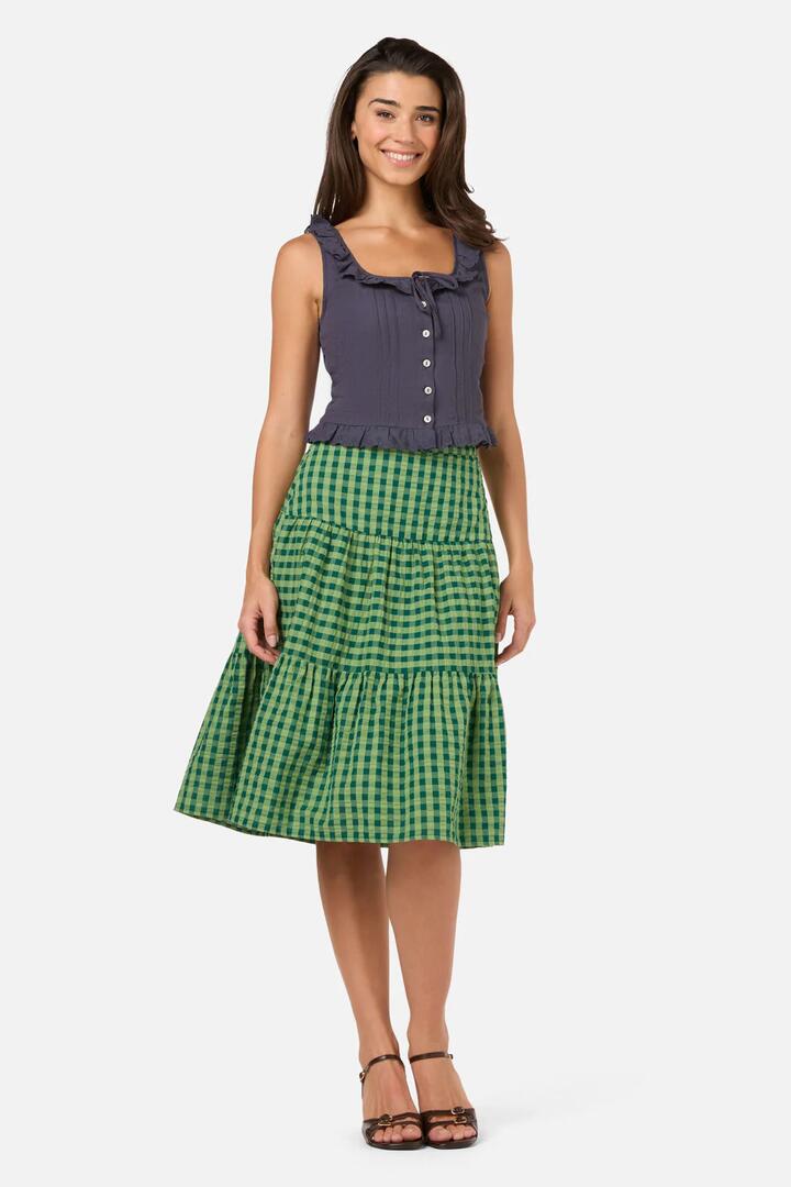 Image of a model wearing Skirts. Product name - Margot Check Tiered Skirt in Green colour by brand - Princess Highway