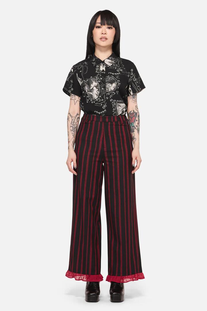 Image of a model wearing Pants. Productname: Ritualistic Goth Ruffle Pant in Red/Black colour by brand - Black Friday