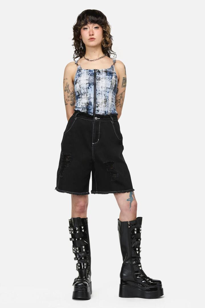 Image of a model wearing Shorts. Product name - Divination Goth Ripped Short in Black colour by brand - Dangerfield