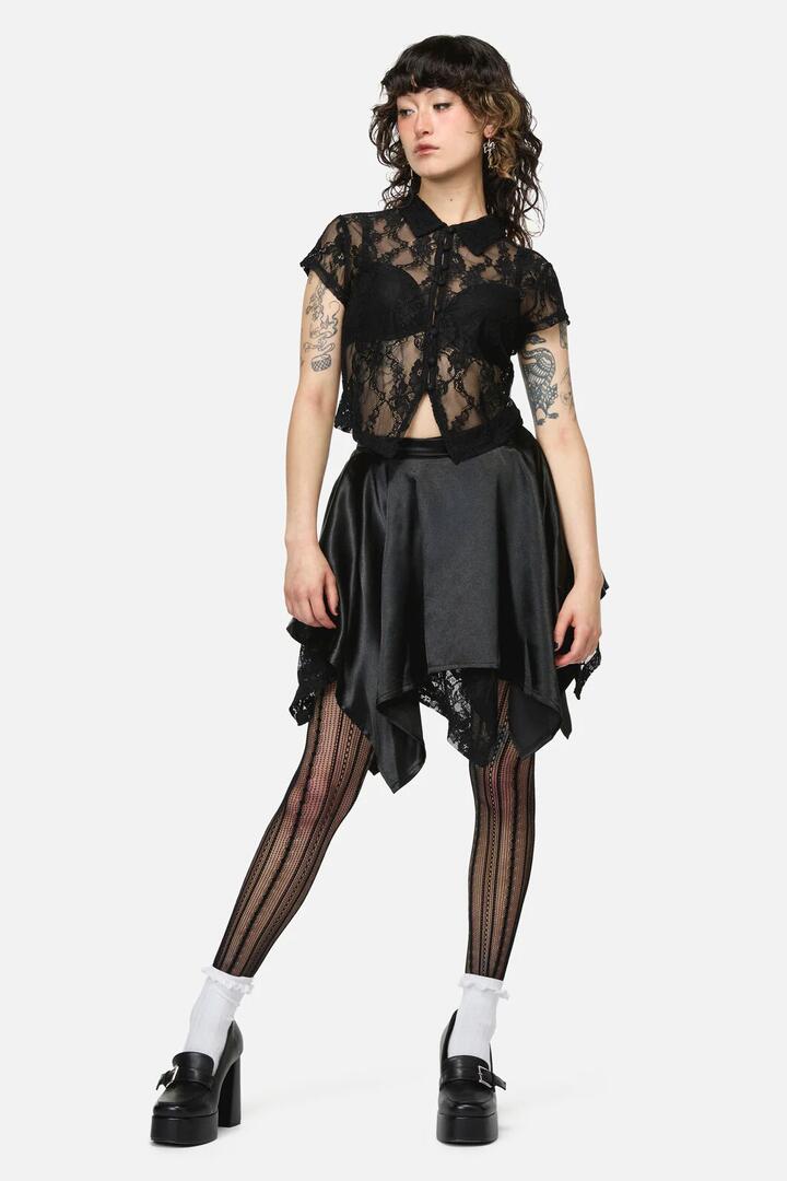Image of a model wearing Skirts. Product name - Pond Lace Goth Skort in Black colour by brand - Dangerfield