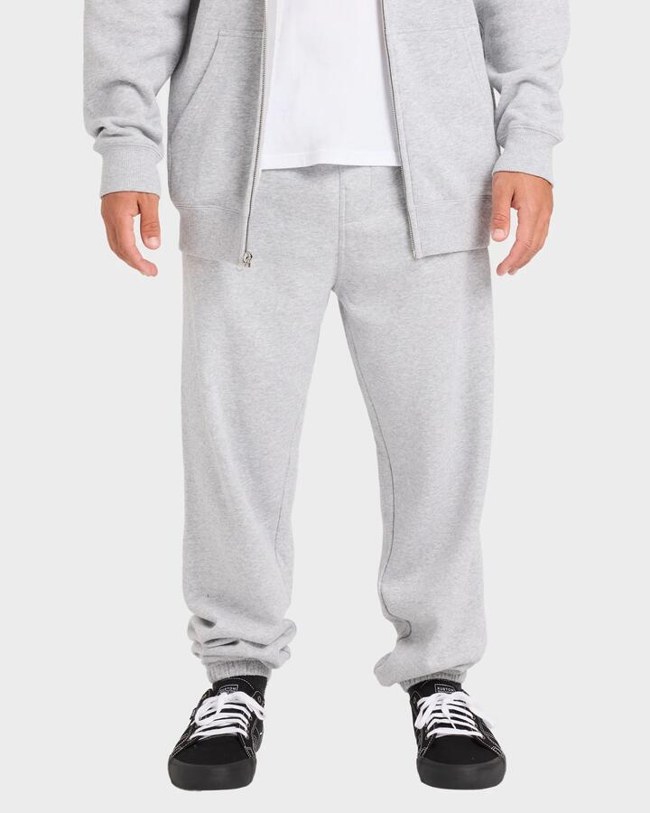 Image of a model wearing Pants. Product name - Billabong Mens Premium Wave Wash Trackpants Light Grey Heather in Light Grey Heather colour by brand - Billabong