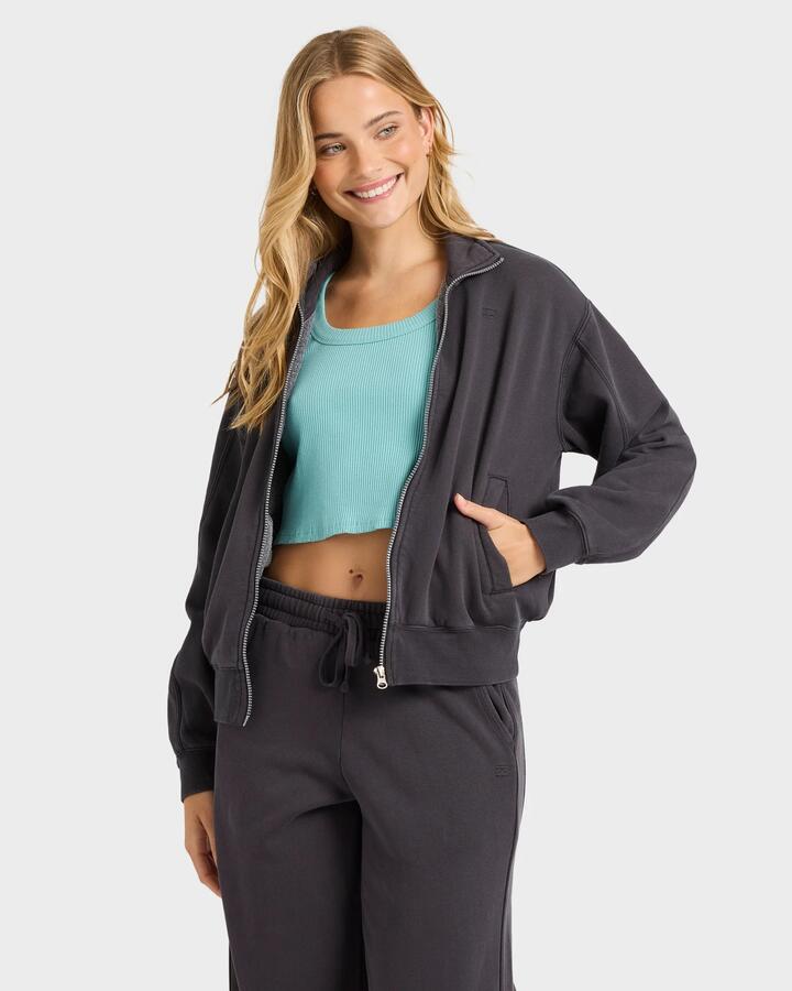 Image of a model wearing Outerwear. Product name - Billabong Womens The Avery Zip Fleece Top Black Sands in Black Sands colour by brand - Billabong