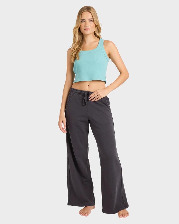 Image of a model wearing Outerwear. Product name - Billabong Womens The Avery Fleece Sweatpants Black Sands in Black Sands colour by brand - Billabong