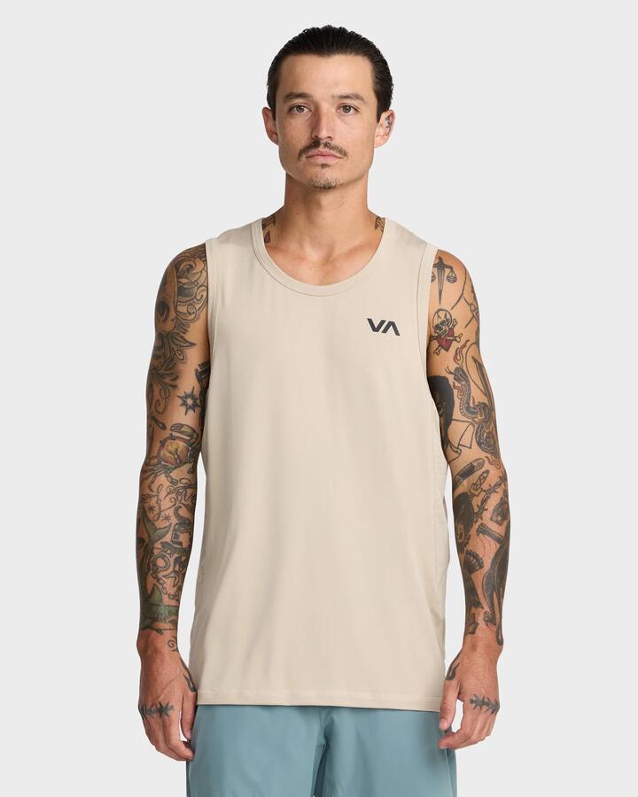 Image of a model wearing Tops. Product name - RVCA Mens Sport Vent Tank Top Light Khaki in Light Khaki colour by brand - RVCA