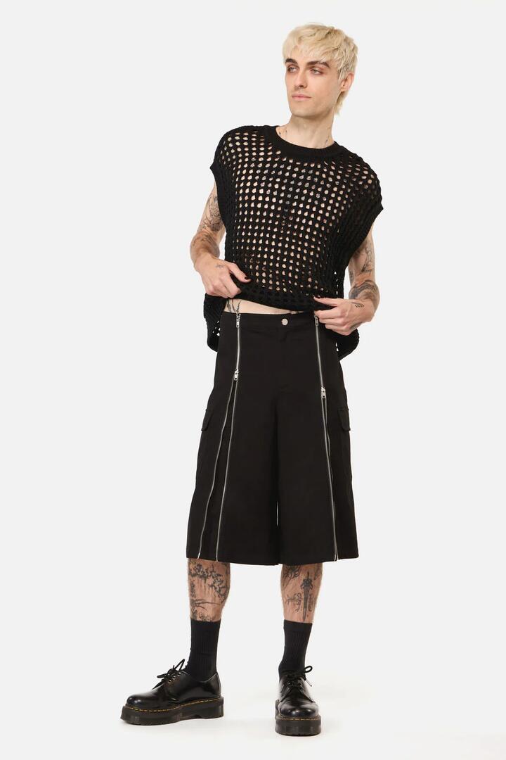 Image of a model wearing Shorts. Product name - Goodie Zip Cargo Short in Black colour by brand - Black Friday
