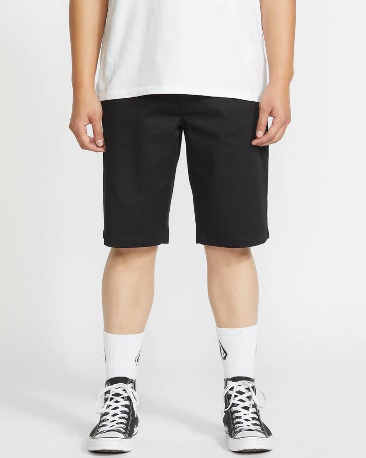 Image of a model wearing Pants. Product name - Volcom Mens Frickin Modern Stretch Chino Pants Black in Black colour by brand - Volcom