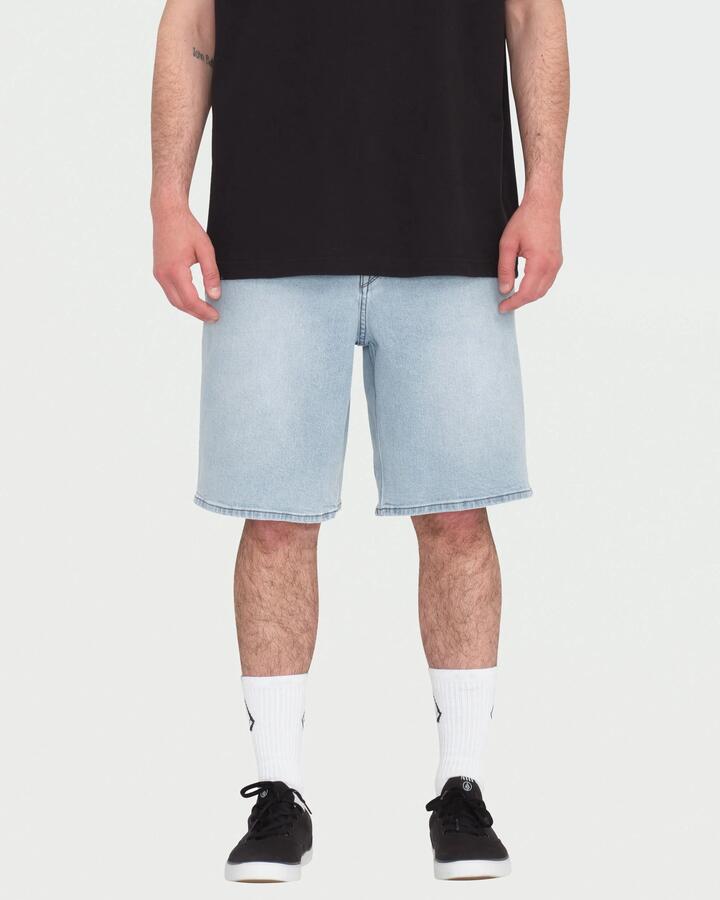 Image of a model wearing Shorts. Product name - Volcom Mens Billow Denim Shorts Desert Dirt Indigo in Desert Dirt Indigo colour by brand - Volcom