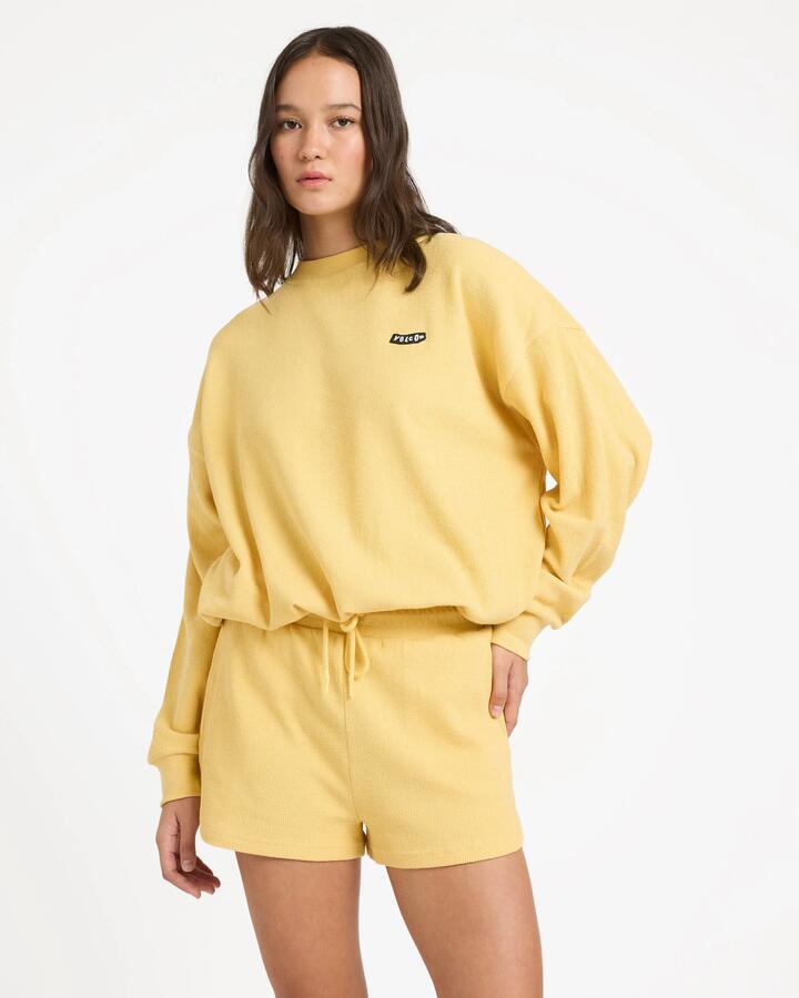 Image of a model wearing Shorts. Productname: volcom - Womens Sweeterry Elastic Waist Shorts - Sunburst - in Sunburst colour by brand - volcom